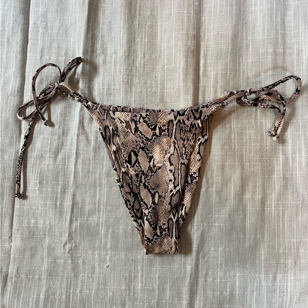 Snake print tie side bottoms more on the cheeky side but there is a little cover